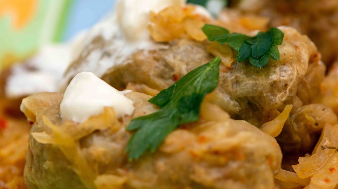 Traditional romanian dish SARMALE eaten with sour cream