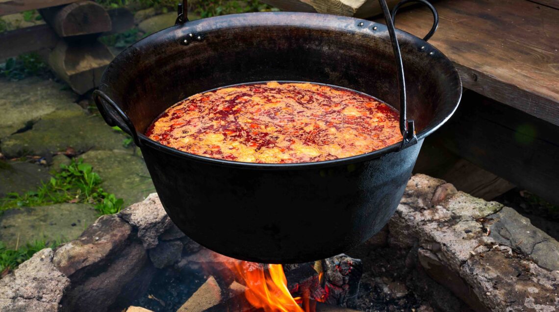 traditional Hungarian Goulash soup in cauldron