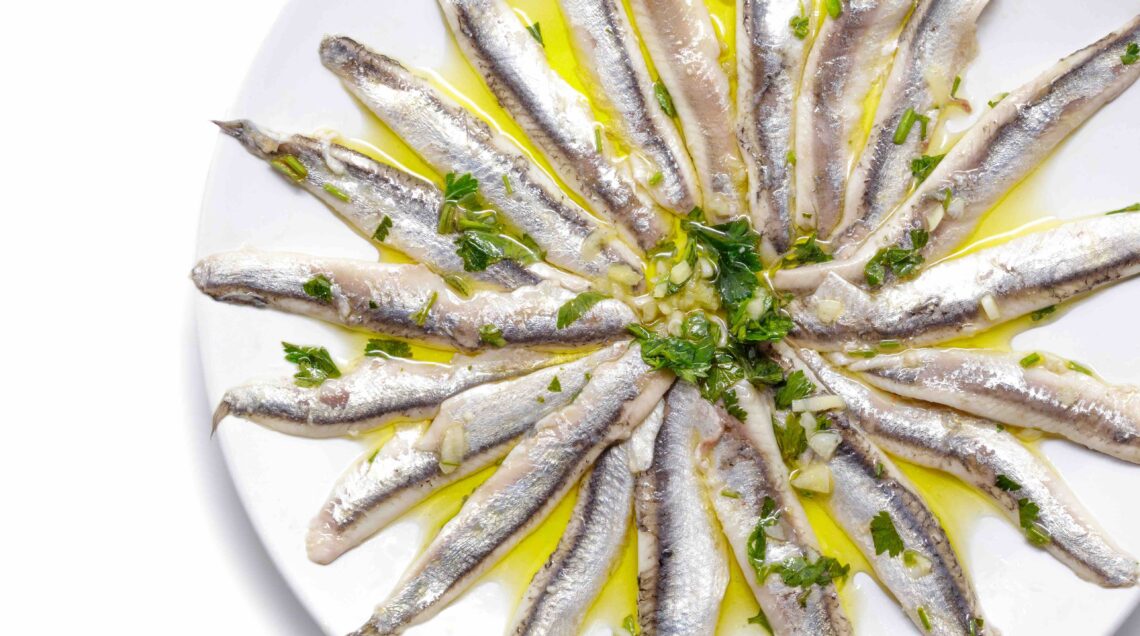 BOUQUERONES - Marinated anchovies with parsley, olive oil and vinegar