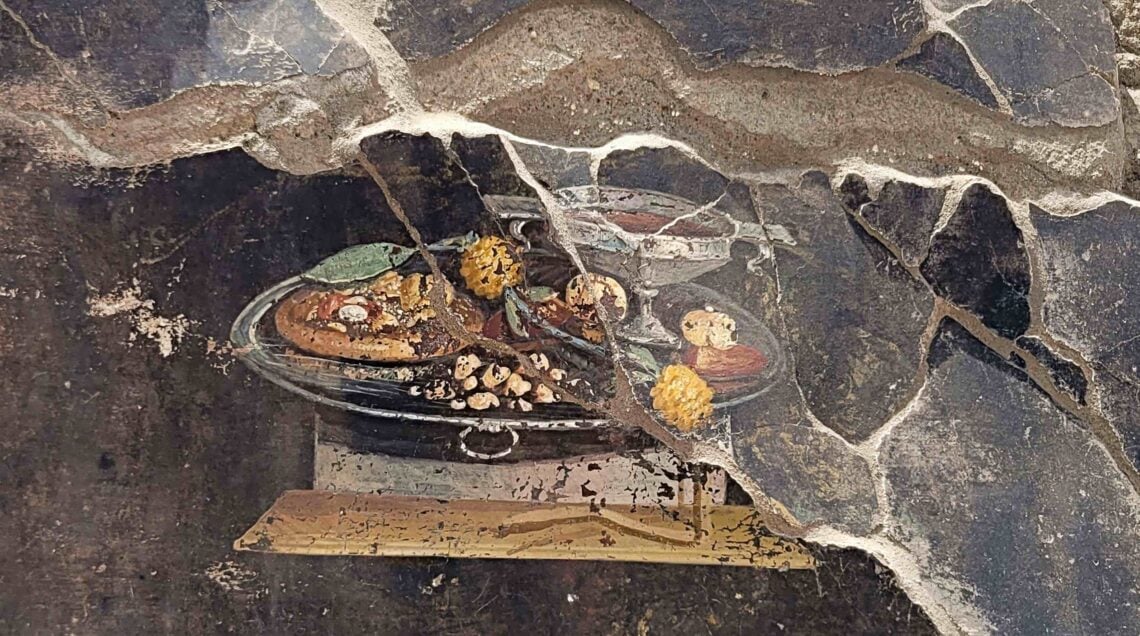 PANIS FUCACIUS Parco Archeologico di Pompei (Archaeological Park of Pompeii), shows a 2,000-year-old Pompeian painting
