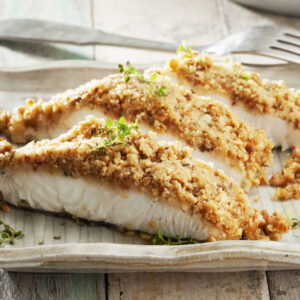 filetto di pesce con panatura aromatica di pinoli e timo